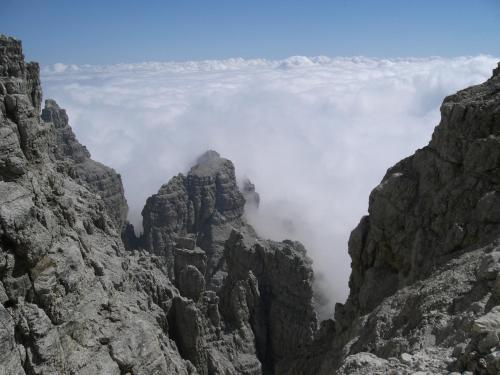 a view from the top of a mountain in the clouds at Albergo Alpino in Vermiglio