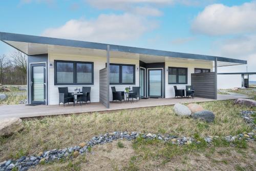 a tiny house on the beach with a deck at Marina Martinshafen in Sassnitz