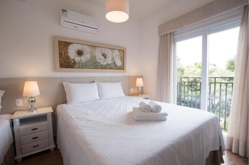 Cama o camas de una habitación en Apartamento em otima localizacao em Gramado
