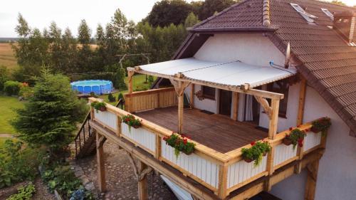 an overhead view of a house with a deck at Agroturystyka „Między Polami” in Zalewo