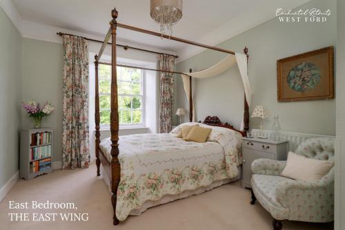 a bedroom with a bed and a chair and a window at Enchanted Retreats at West Ford Devon in South Molton
