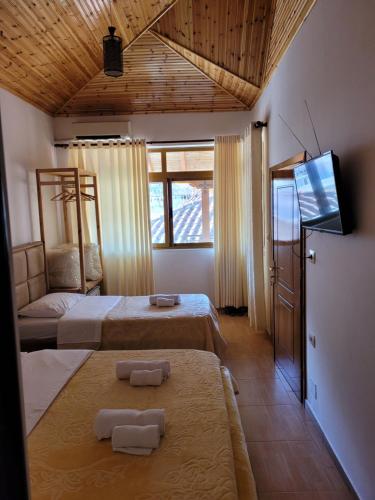Postel nebo postele na pokoji v ubytování Nako Guest House bar&restaurants