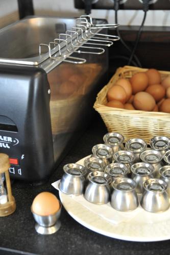 Kuchyň nebo kuchyňský kout v ubytování Logis Cottage Hotel