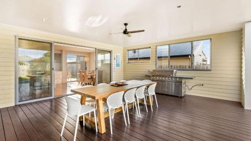 a dining room with a table and chairs at Bliss on Sanctuary in Cowes