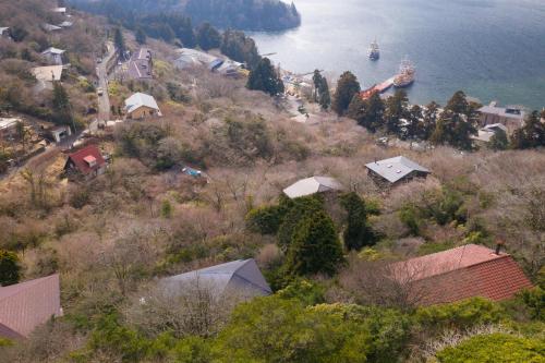 a view of a town with a ship in the water at VILLA HAKONE湖空 in Hakone