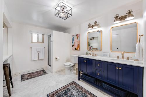 a bathroom with a blue sink and a toilet at Paradise in the Palisades in Lake Arrowhead