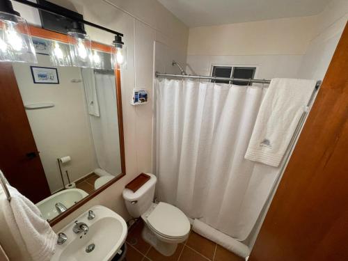 a bathroom with a toilet and a sink and a shower at Villa Solara 6 - Luxury 6 Bedroom Villa with Pool, Golf & Lake View in Río Hato