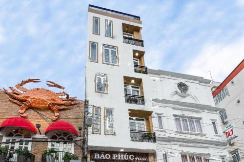 a building with a statue of a crab on it at Bao Phuc Hotel in Phu Quoc