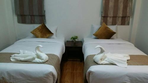 Llit o llits en una habitació de Ouidee Resort