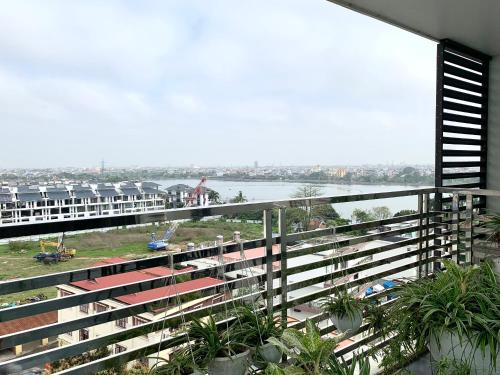 a balcony of a building with a view of the water at HOTEL Blue Rose in Hai Phong