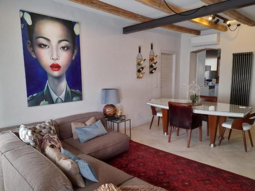 a living room with a couch and a table at LaRiva 11 L'angolo segreto di Sarnico Lake Iseo in Sarnico