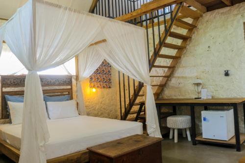 Postel nebo postele na pokoji v ubytování Chanteak Bali - Stone House 2