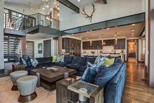 a living room with a couch and a table at Stunning 6-Bedroom Chalet in Heart of Park City home in Park City