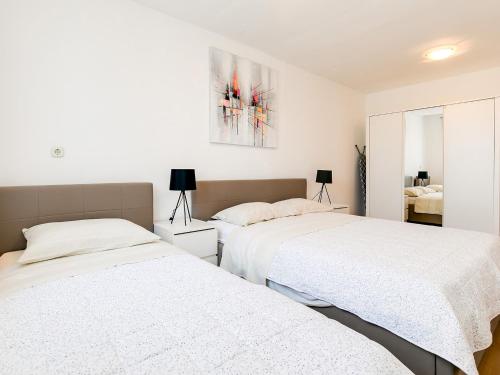 Postel nebo postele na pokoji v ubytování Apartments Nada