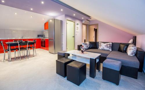 a living room with a couch and a table at Dorothea Suite in Potos