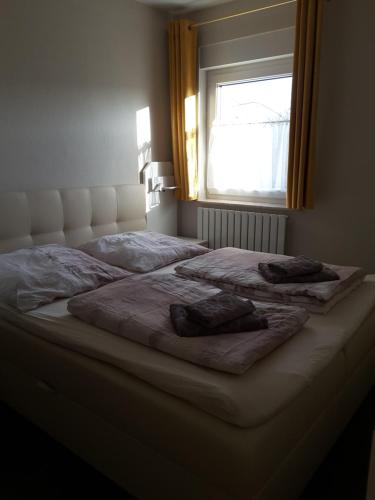 Ein Bett oder Betten in einem Zimmer der Unterkunft Strandidyll