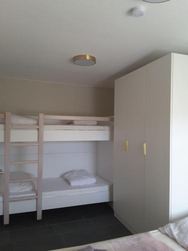 Ein Bett oder Betten in einem Zimmer der Unterkunft Strandidyll