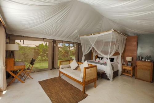 Voodi või voodid majutusasutuse Bali Beach Glamping toas