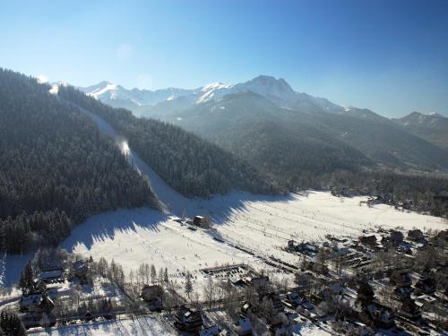 an aerial view of a ski resort in the snow at Rezydencja Nosalowy Dwór in Zakopane