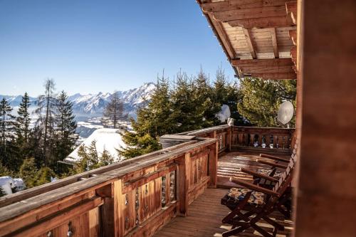 a deck with a view of a snowy mountain at Ferienhaus Haus Gilfert in Pill