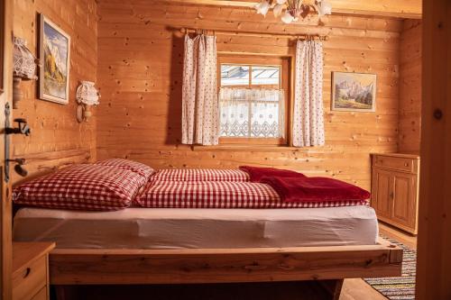 מיטה או מיטות בחדר ב-Ferienhaus Haus Gilfert