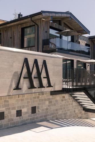a building with aaa sign on the side of it at GOING TRIPLE A apartments WEST in Going