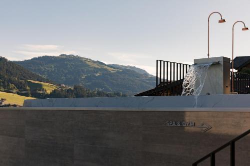 a skate park with a skateboard ramp and a mountain at GOING TRIPLE A apartments WEST in Going