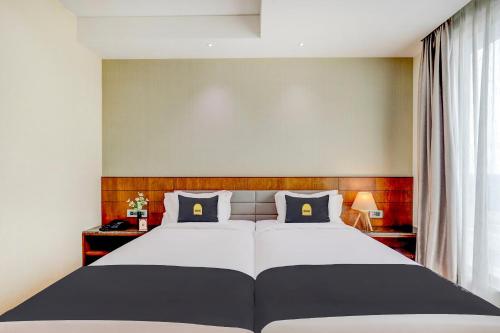 Una cama o camas en una habitación de Hotel Elements