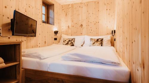 Katil atau katil-katil dalam bilik di Hofgut Apartment & Lifestyle Resort Wagrain