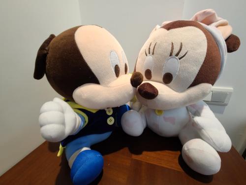 two stuffed animals are sitting on a table at Love Happiness Inn in Suao
