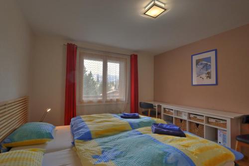 Tempat tidur dalam kamar di Appartement Ancien Comté