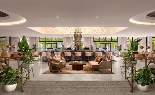 a lobby of a hotel with a bar at PGA National Resort in Palm Beach Gardens