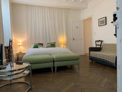 Ένα ή περισσότερα κρεβάτια σε δωμάτιο στο Appart Tourisme