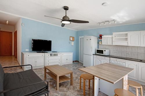 a kitchen with a table and a dining room at Suite On the Beach in Playa del Cura