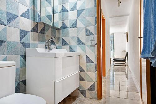 a bathroom with a sink and a toilet at Suite On the Beach in Playa del Cura