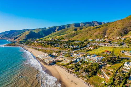 an aerial view of a beach with houses at Luxury in Malibu in Malibu