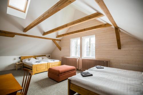 Postel nebo postele na pokoji v ubytování Turnovská chata