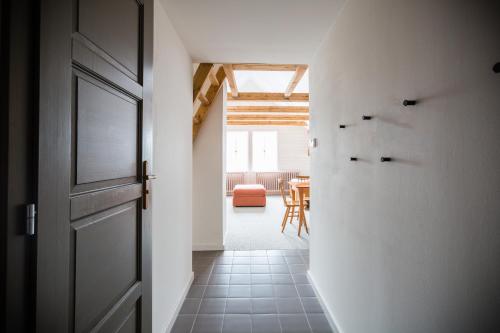 a hallway with a door and a dining room at Turnovská chata in Kořenov