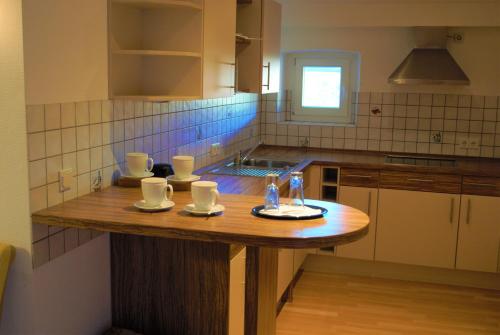 A kitchen or kitchenette at Hotel am Bahnhof