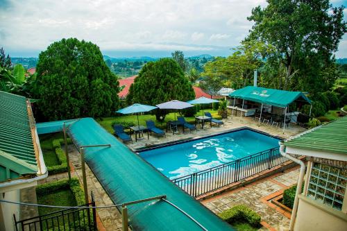an overhead view of a swimming pool with a water slide at Fort Motel in Fort Portal