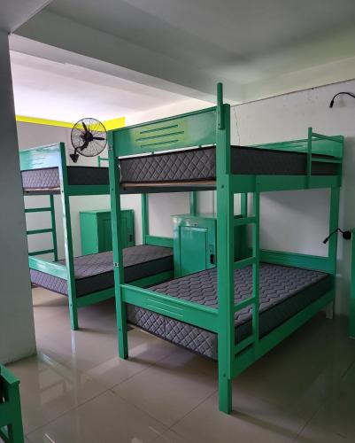 a room with two bunk beds in a room at Mega Hostel in Mirissa