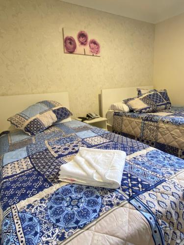 Ένα ή περισσότερα κρεβάτια σε δωμάτιο στο Haven Hotel