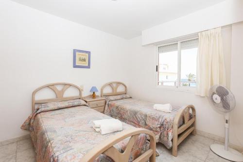 A bed or beds in a room at 166 Talima C-3-A- Deniasol