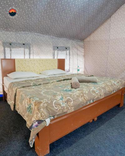 a bedroom with a bed in a room at Camp Brook - Luxury Camping in Rishikesh in Rishīkesh