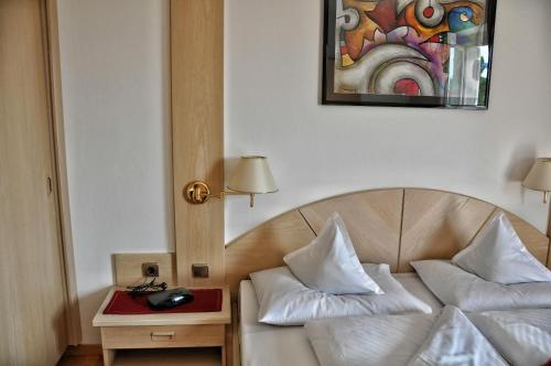 Postel nebo postele na pokoji v ubytování Hotel Brunner