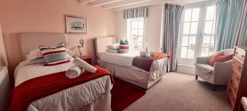 A bed or beds in a room at Itchenor Sailing Club