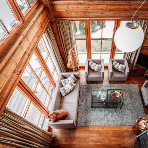 an overhead view of a living room with windows at IM WEIDACH Superior Chalets in Leutasch