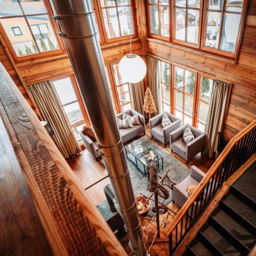 an overhead view of a living room in a log cabin at IM WEIDACH Superior Chalets in Leutasch