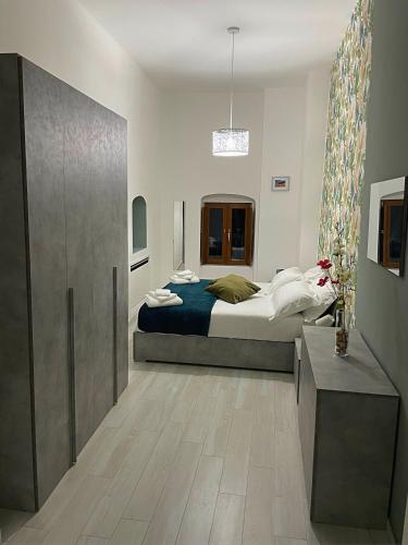 a bedroom with a bed in a room at Arcaroli Borgo Vico "La Casetta" in Vico del Gargano