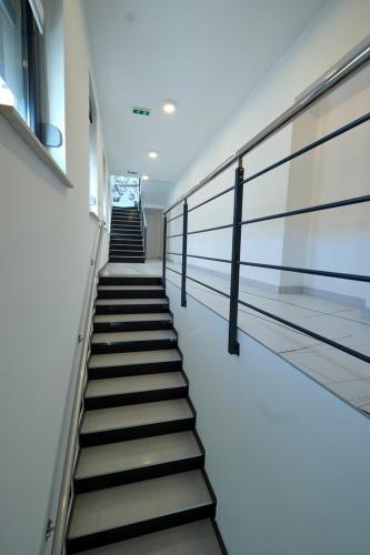 a stairway in a building with stairs leading up at Marien Haus in Karlovac